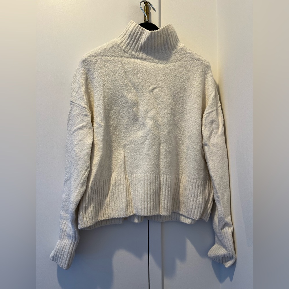 Snow white turtleneck wool sweater